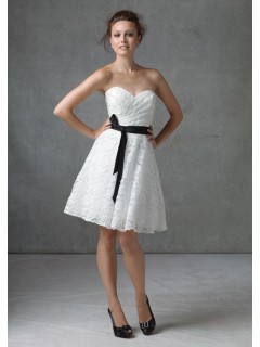 A line strapless knee length short white lace dress with black sash